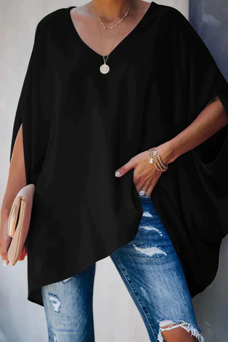 Comfortable women's oversized tunic top with batwing sleeves and a V-neck, offering a relaxed and loose fit.