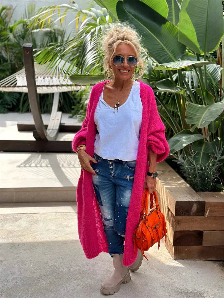 Relaxed fit women's oversized bohemian knit cardigan. Longline, vibrant, open front statement piece.