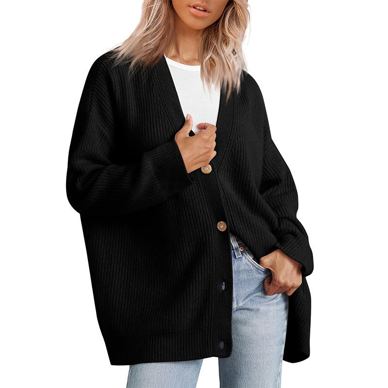 Women's oversized button-up cardigan in a cozy knit, perfect for fall fashion & everyday comfort.