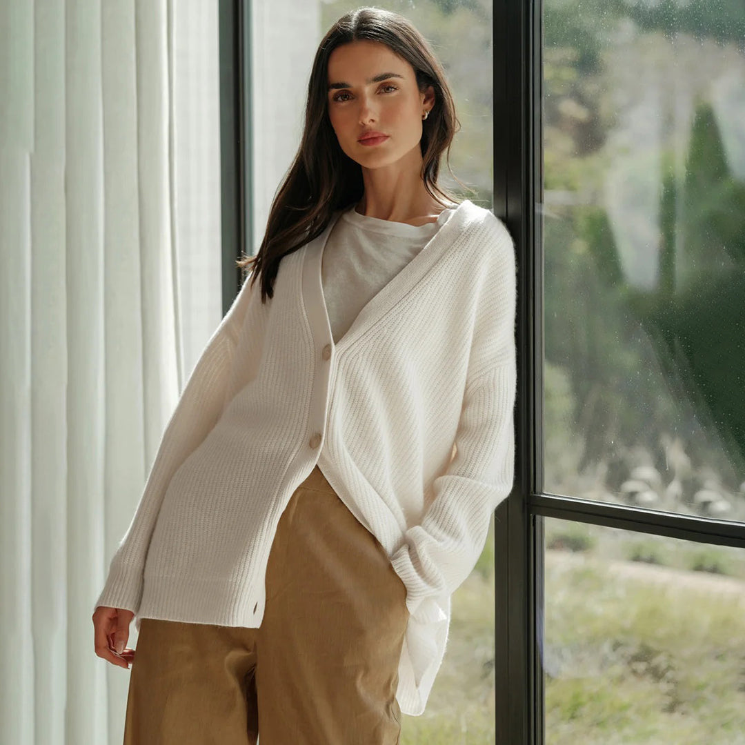 Women's oversized long-sleeve cardigan, styled open as a casual layering piece for everyday.