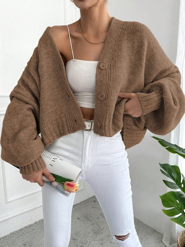 Warm, oversized chunky knit cardigan for women, featuring a cozy wool blend and stylish design.