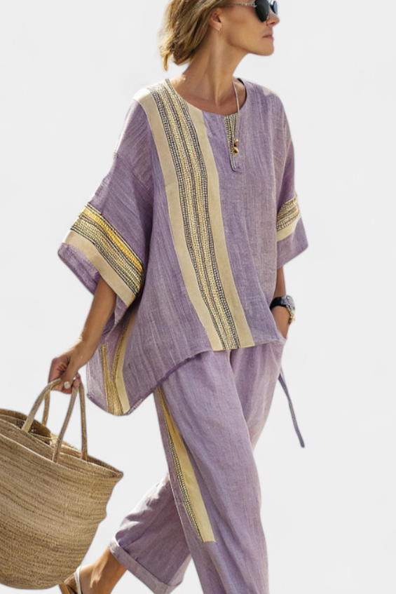 Casual chic women's co-ord set with embroidered top & striped trousers, perfect for travel outfits.