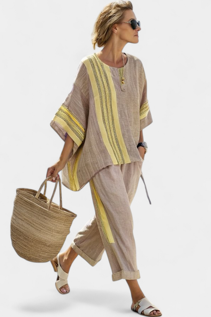 Complete women's two-piece set: oversized embroidered top and relaxed fit stripe trim trousers.