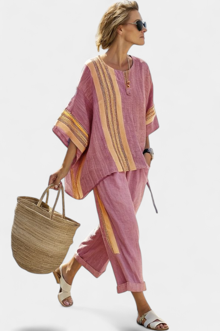 Comfortable women's travel co-ord set: oversized embroidered top & relaxed stripe trousers.