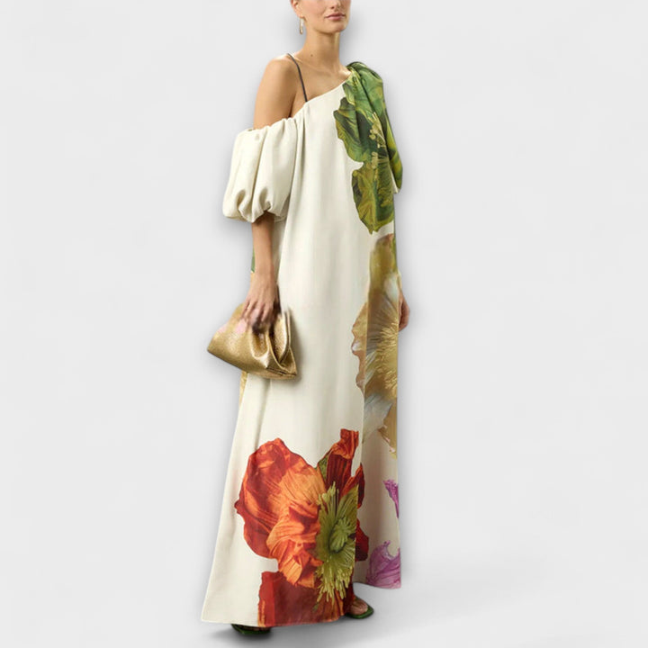 Long women's oversized maxi dress with vibrant floral print and chic off-shoulder puff sleeves.
