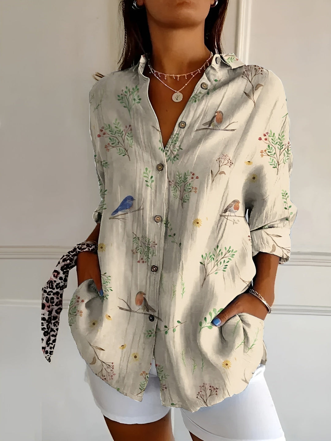 Elegant floral vine print women's oversized button down blouse. Casual long sleeve top, ideal for spring.