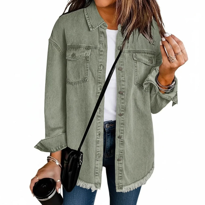 Fashionable women's oversized shirt jacket with fringe hem. Provides relaxed fit and stylish casual outerwear.