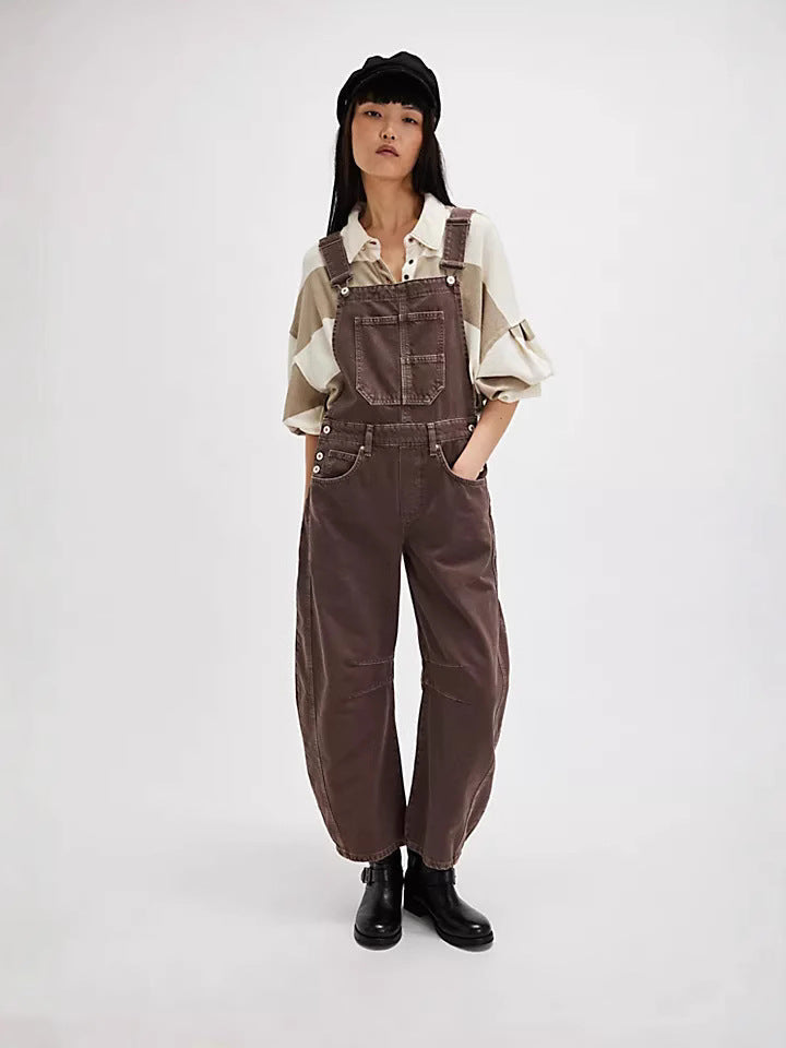 Fashionable women's oversized jumpsuit with wide legs & adjustable straps, designed for relaxed comfort.