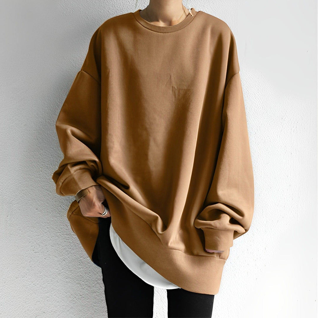 Women's oversized fit sweatshirt with dropped shoulders. Cozy, comfortable, loose-fit for casual everyday fashion.