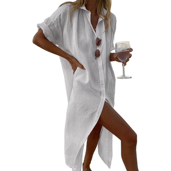 Comfortable oversized beach shirt dress for women with button-down front & roll sleeves, great for seaside lounging.
