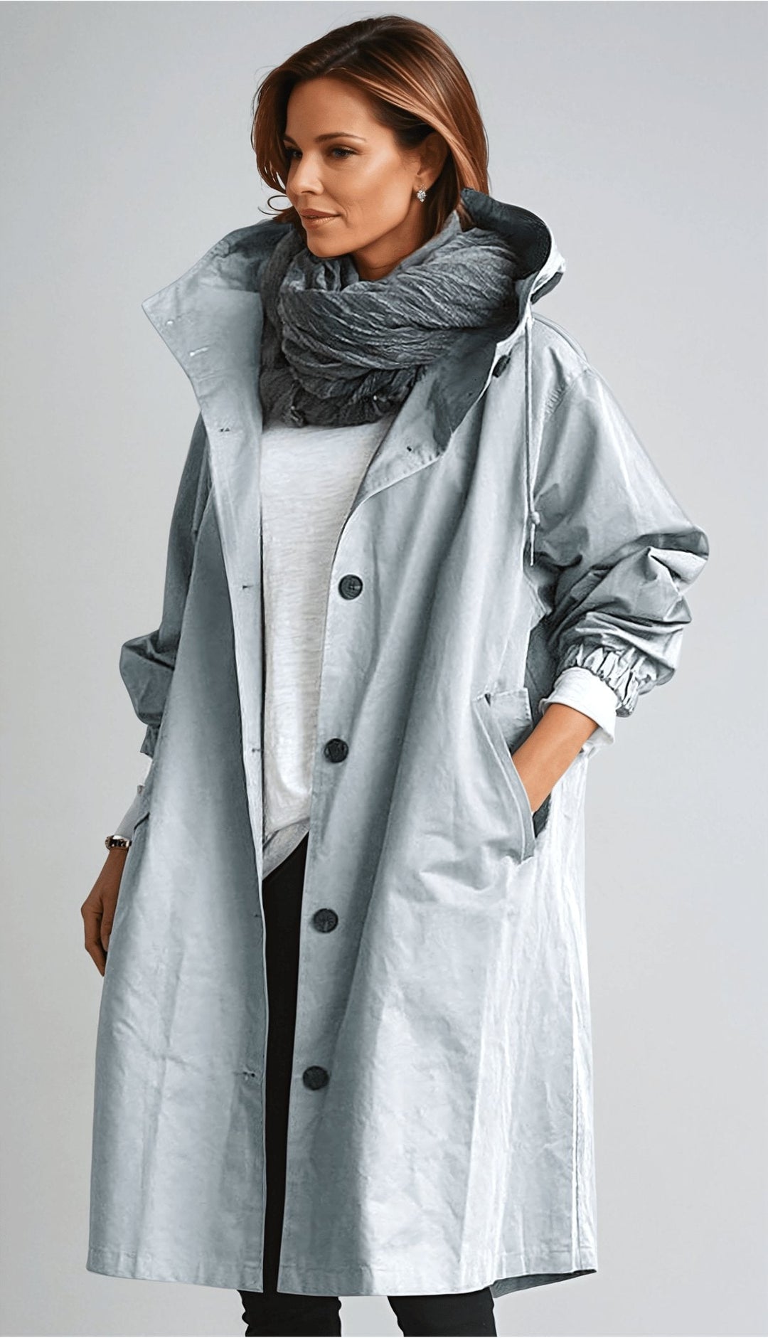 Women's oversized rain parka trench coat. Stylish and water-resistant for weather protection.