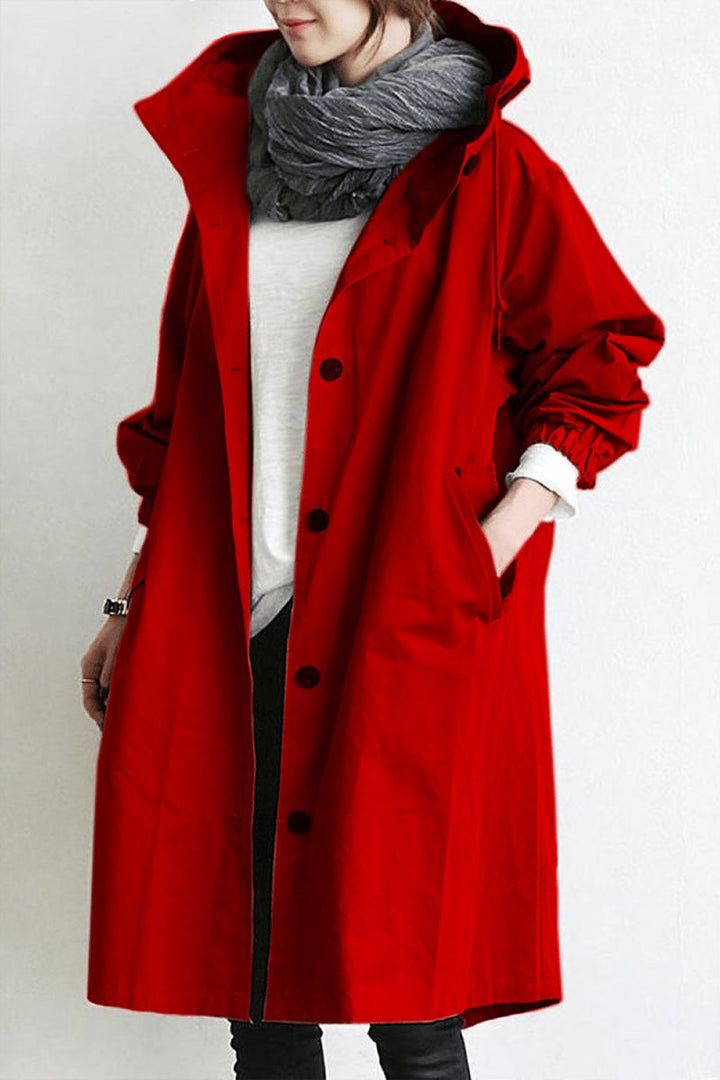 Stylish women's oversized rain trench coat. Versatile layering piece for casual chic weather protection.