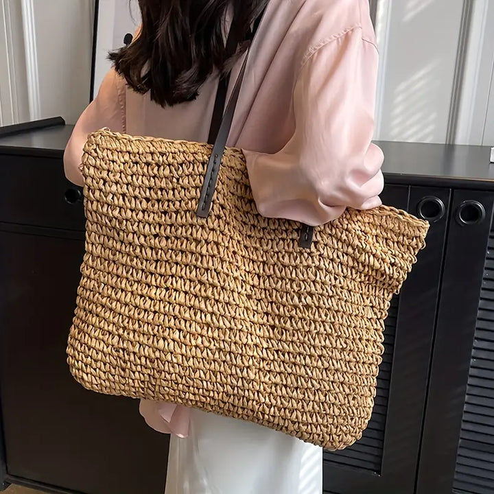 Stylish oversized straw tote bag for women, a beach & travel essential for summer fashion.