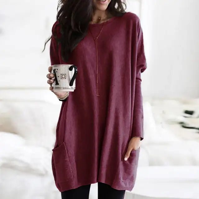 Women's oversized tunic top with pockets, offering a relaxed fit for comfortable casual everyday wear.