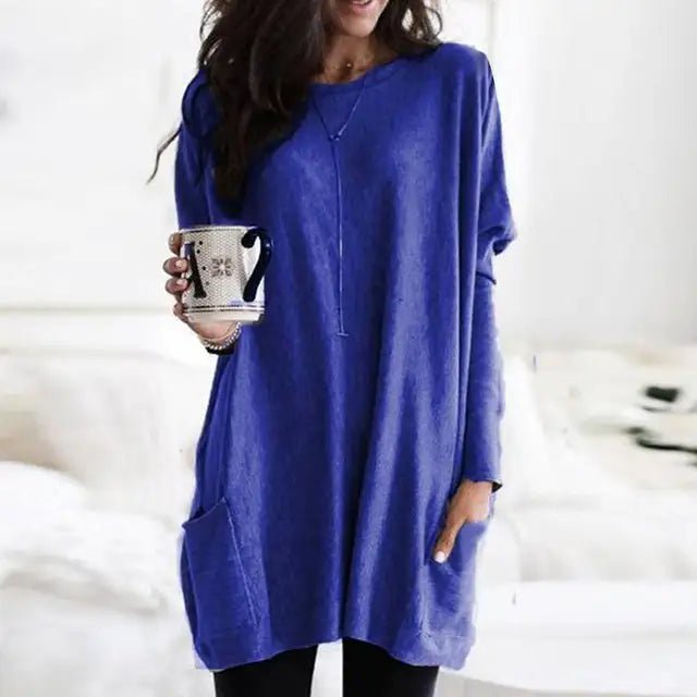 Front view of women's oversized tunic top, showcasing spacious pockets & long sleeves for a comfortable casual look.