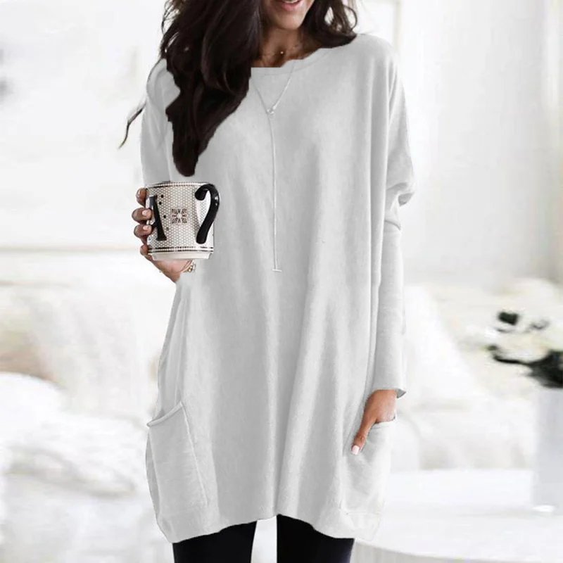 Simple yet stylish women's oversized tunic top with pockets, essential for comfortable, relaxed fit casual wear.