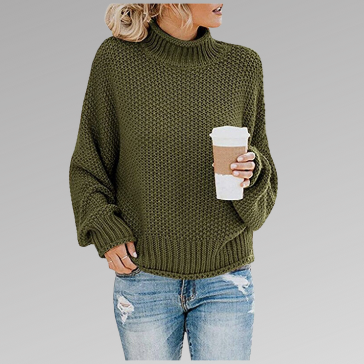 Chunky knit oversized women's sweater in a warm turtleneck style, ideal for cozy casual wear.