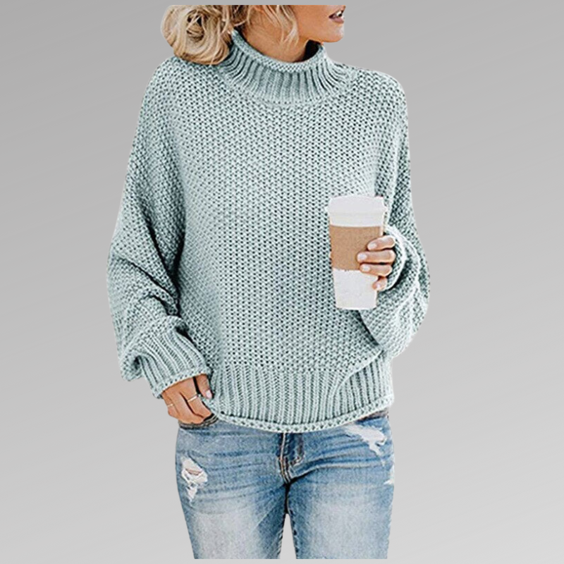 Elegant women's oversized turtleneck sweater, a luxurious chunky knit perfect for relaxed winter outfits.