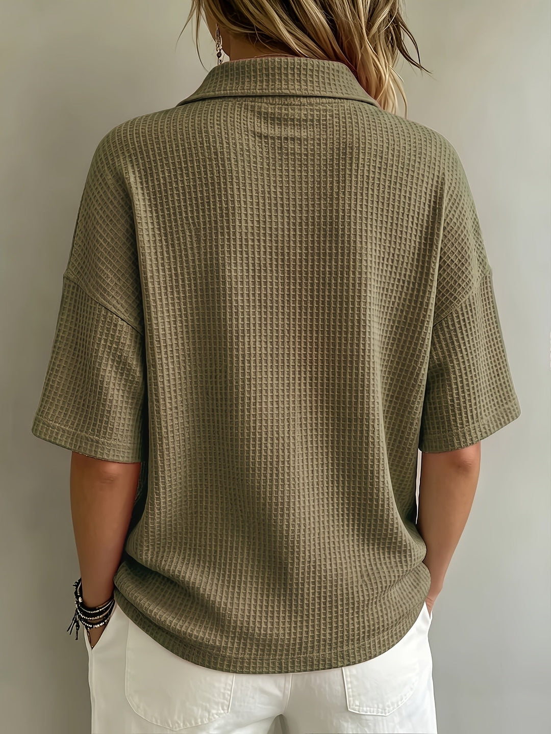 Comfortable oversized women's polo top with cozy waffle texture, perfect for relaxed outfits.