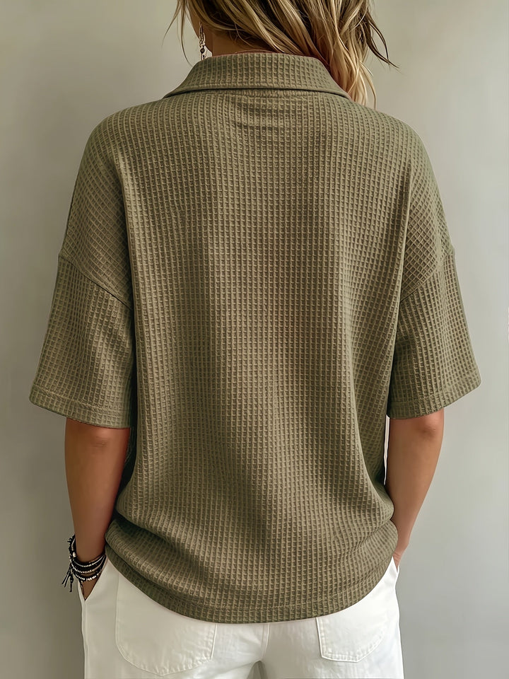 Comfortable oversized women's polo top with cozy waffle texture, perfect for relaxed outfits.