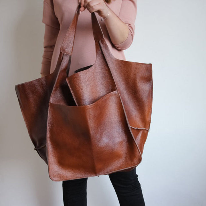 Elegant black oversized shoulder bag, perfect for short trips.
