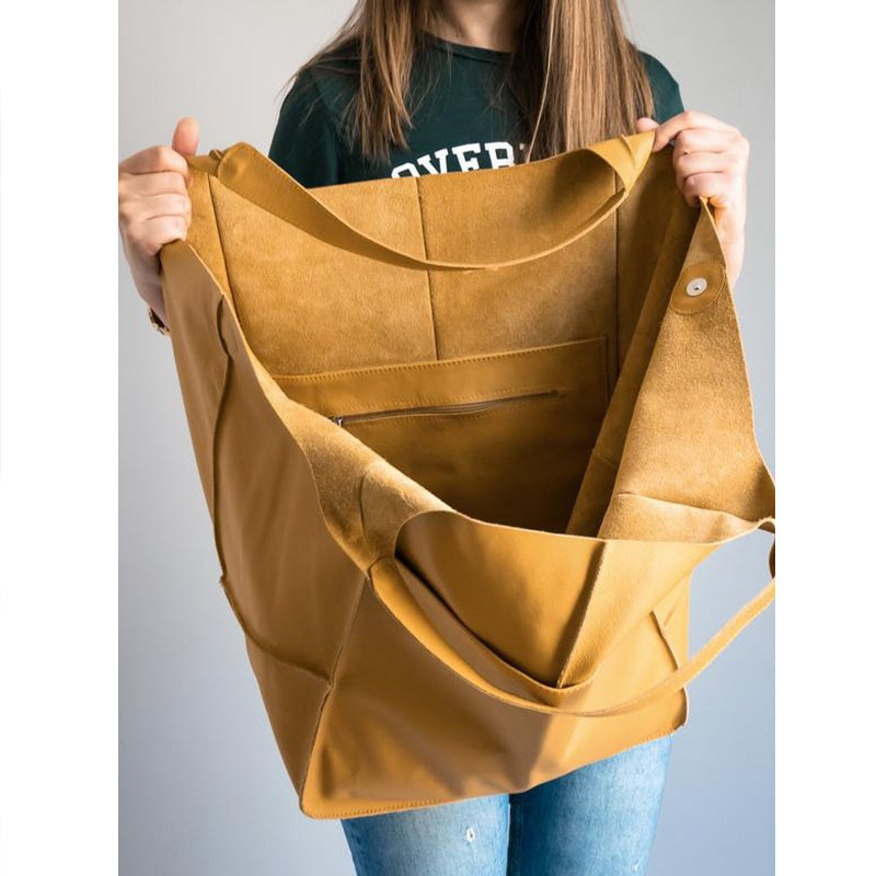Women's versatile brown travel bag, easily fits daily essentials and more.