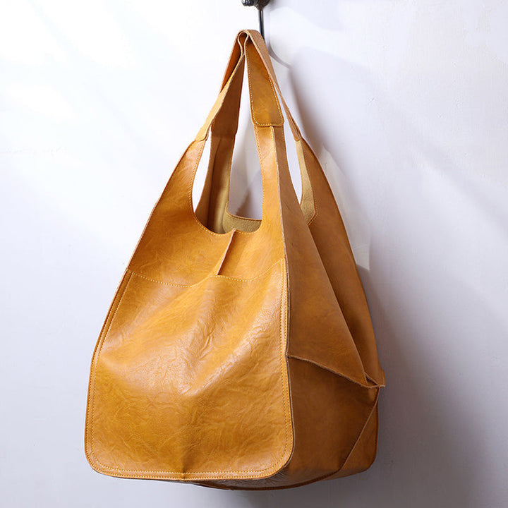 Chic black oversized weekend bag, a must-have for every woman traveler.