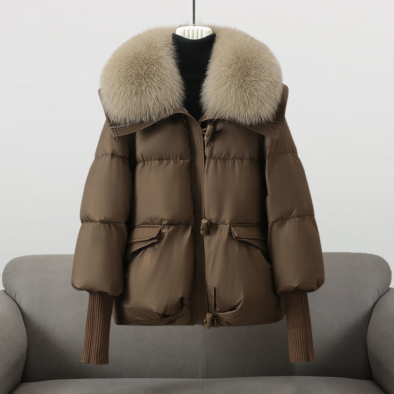 Casual women's outerwear: a warm, padded coat featuring an elegant fur collar