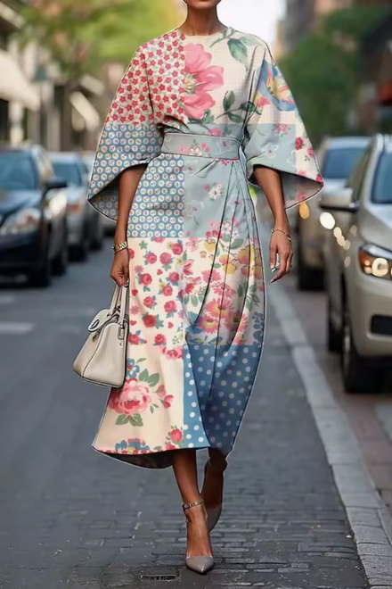 Flowy A-line floral midi dress for women, featuring puff sleeves. Comfortable & elegant for summer occasions.