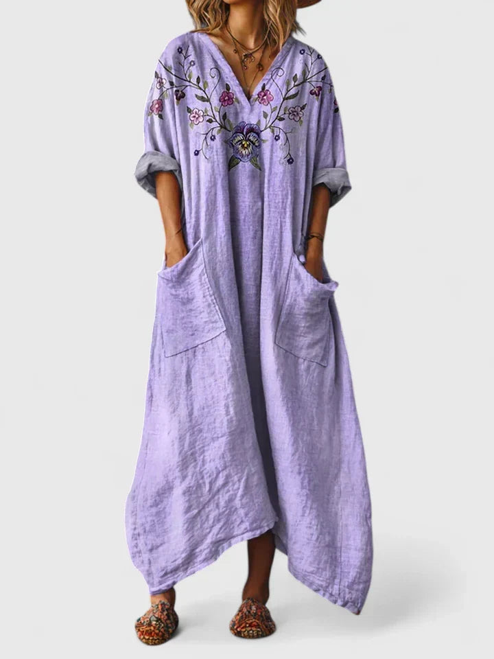 Bohemian paisley print maxi dress for women, featuring a relaxed v-neck and convenient patch pockets.