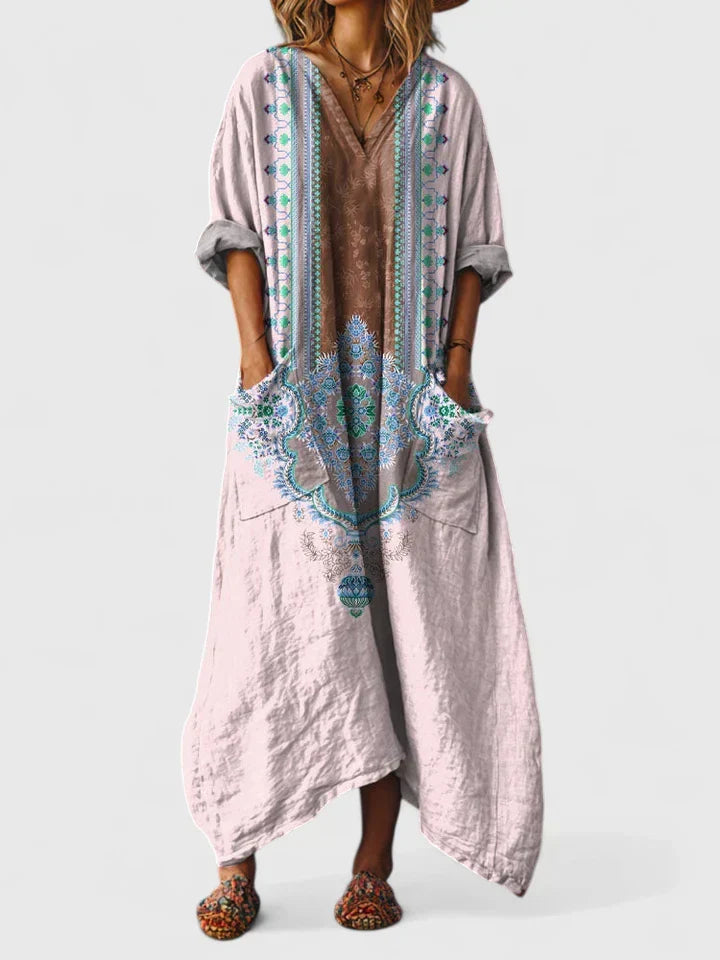 Women's relaxed fit v-neck maxi dress featuring a beautiful paisley pattern, long skirt, and patch pockets.