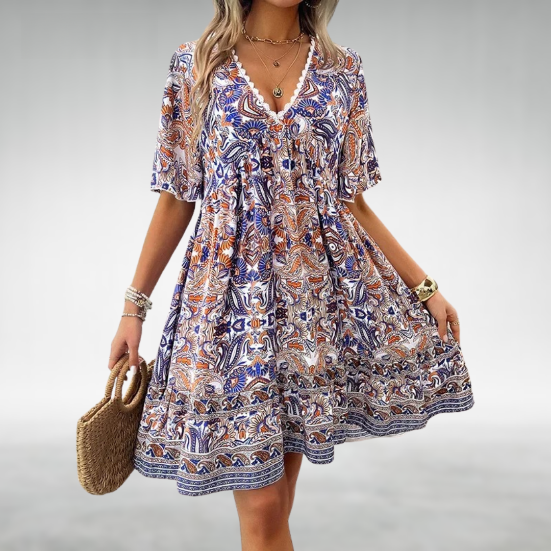 Bohemian paisley babydoll mini dress for women, featuring flutter sleeves, ideal for beach or festival.