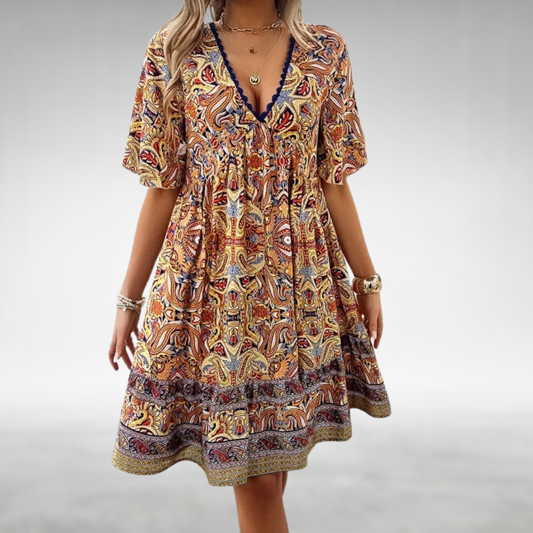 Stylish women's summer boho mini dress in a paisley pattern with delicate lace and tiered ruffles.