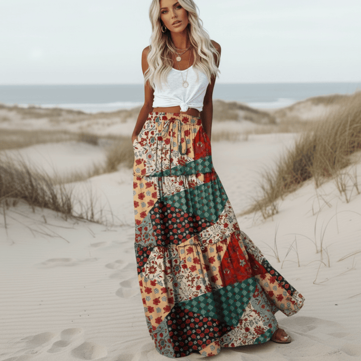 Flowy high-waist women's patchwork floral maxi skirt for comfortable summer fashion or casual vacation wear.