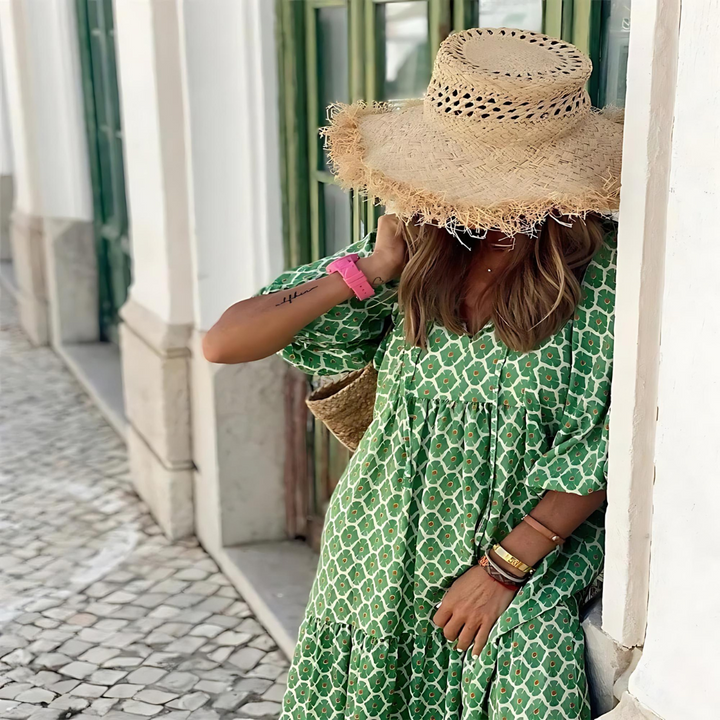Comfortable women's patterned maxi dress. Green long sleeve V-neck style, perfect for elegant casual spring wear.