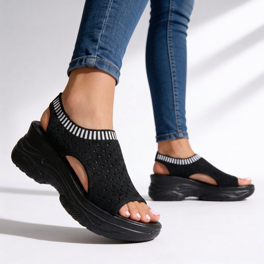 Women's peep toe wedge sandals with flexible mesh upper. Comfortable platform for casual summer walking.