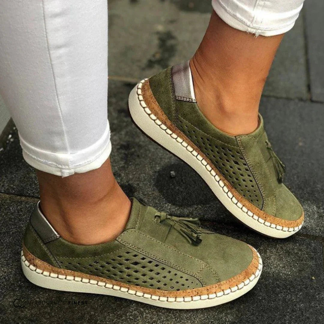 Women's perforated slip-on summer sneakers, offering breathable comfort for everyday casual wear.