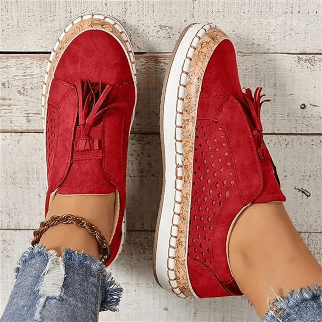 Light & airy women's perforated slip-on sneakers, perfect breathable footwear for summer adventures.