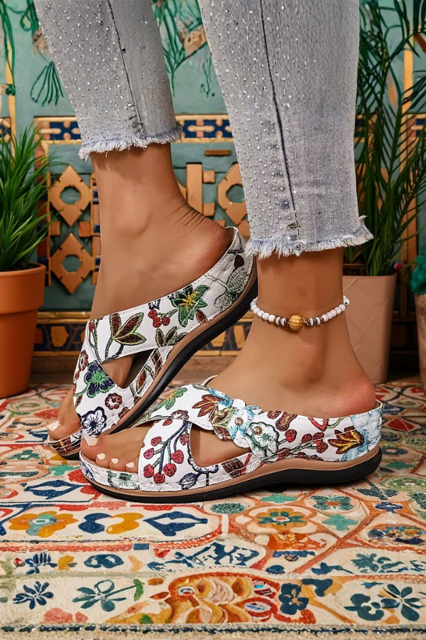 Comfortable women's perforated wedge sandals for casual summer wear. Slip-on design, perfect for everyday fashion.