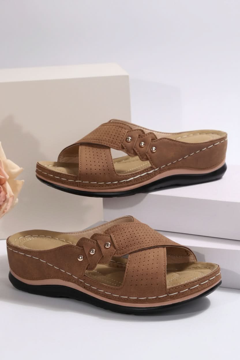 Versatile women's perforated wedge sandals. Cushioned for everyday comfort, great travel shoes & summer style.
