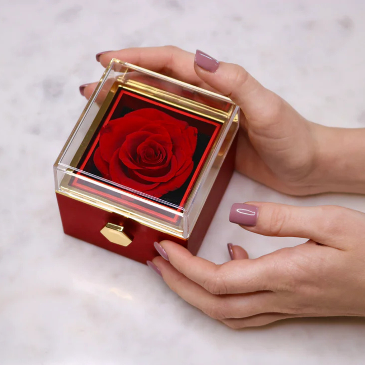 Custom heart pendant necklace with personalized engraving alongside a vibrant preserved eternal rose gift.