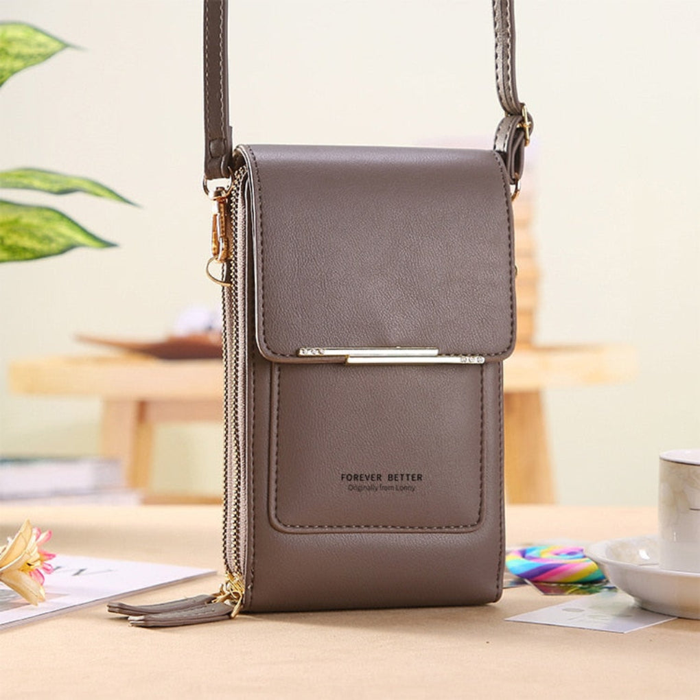 Pink women's phone bag & crossbody purse with a functional touchscreen window. Keeps essentials organized & secure.