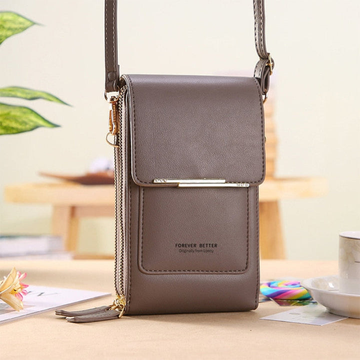 Pink women's phone bag & crossbody purse with a functional touchscreen window. Keeps essentials organized & secure.