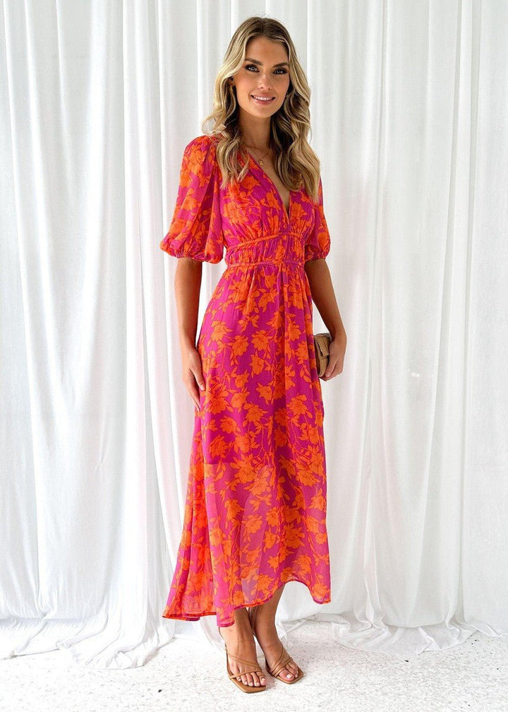 V-neck pink orange floral maxi dress with puff sleeves, ideal for a garden party, brunch, or summer vacation.