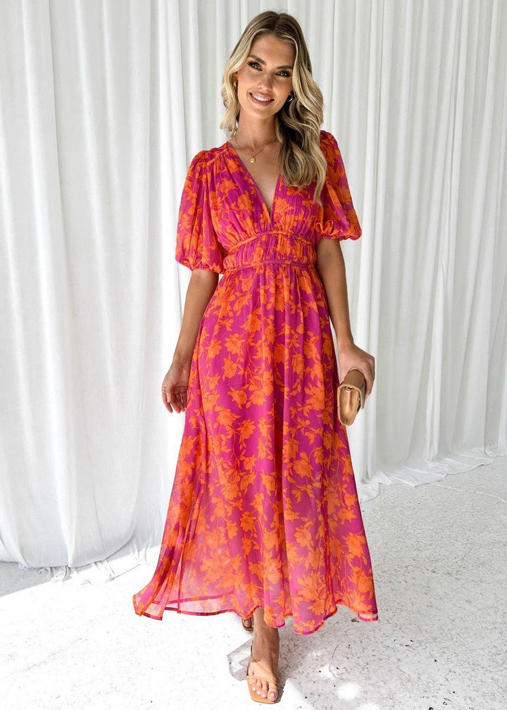 Chic pink orange floral V-neck maxi dress for women, featuring elegant short puff sleeves and a flowing summer style.