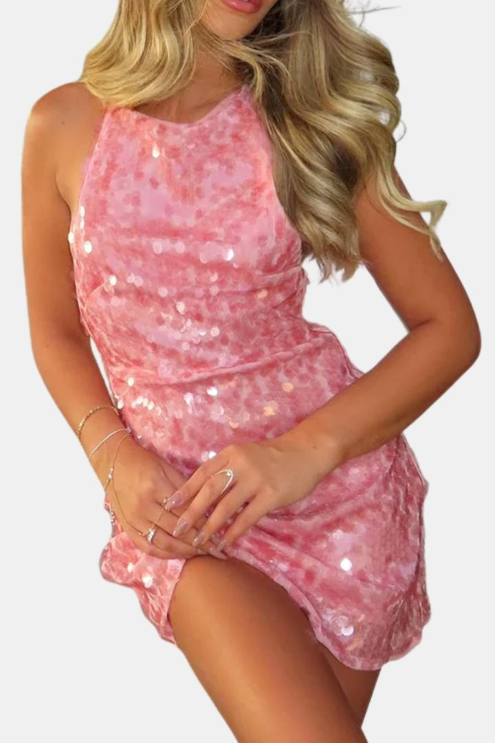 Shimmering pink sequin mini dress with a halter neckline & bodycon fit. A dazzling women's homecoming or party dress.