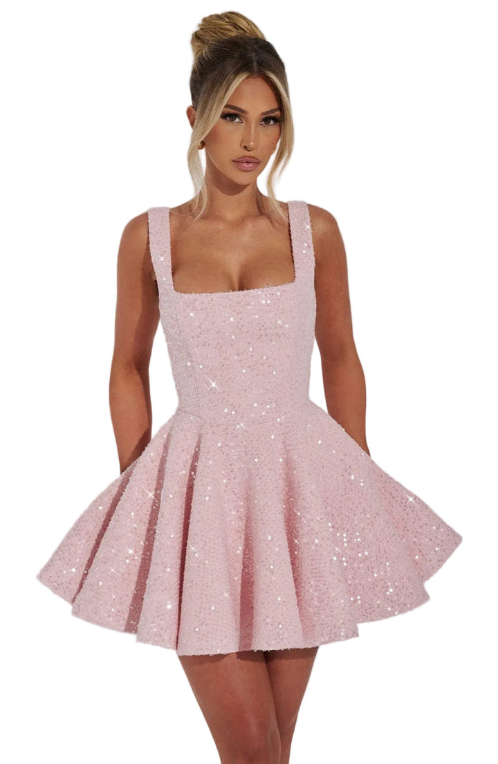 Women's pink sequin skater homecoming dress with bow detail. Perfect for parties & special occasions.