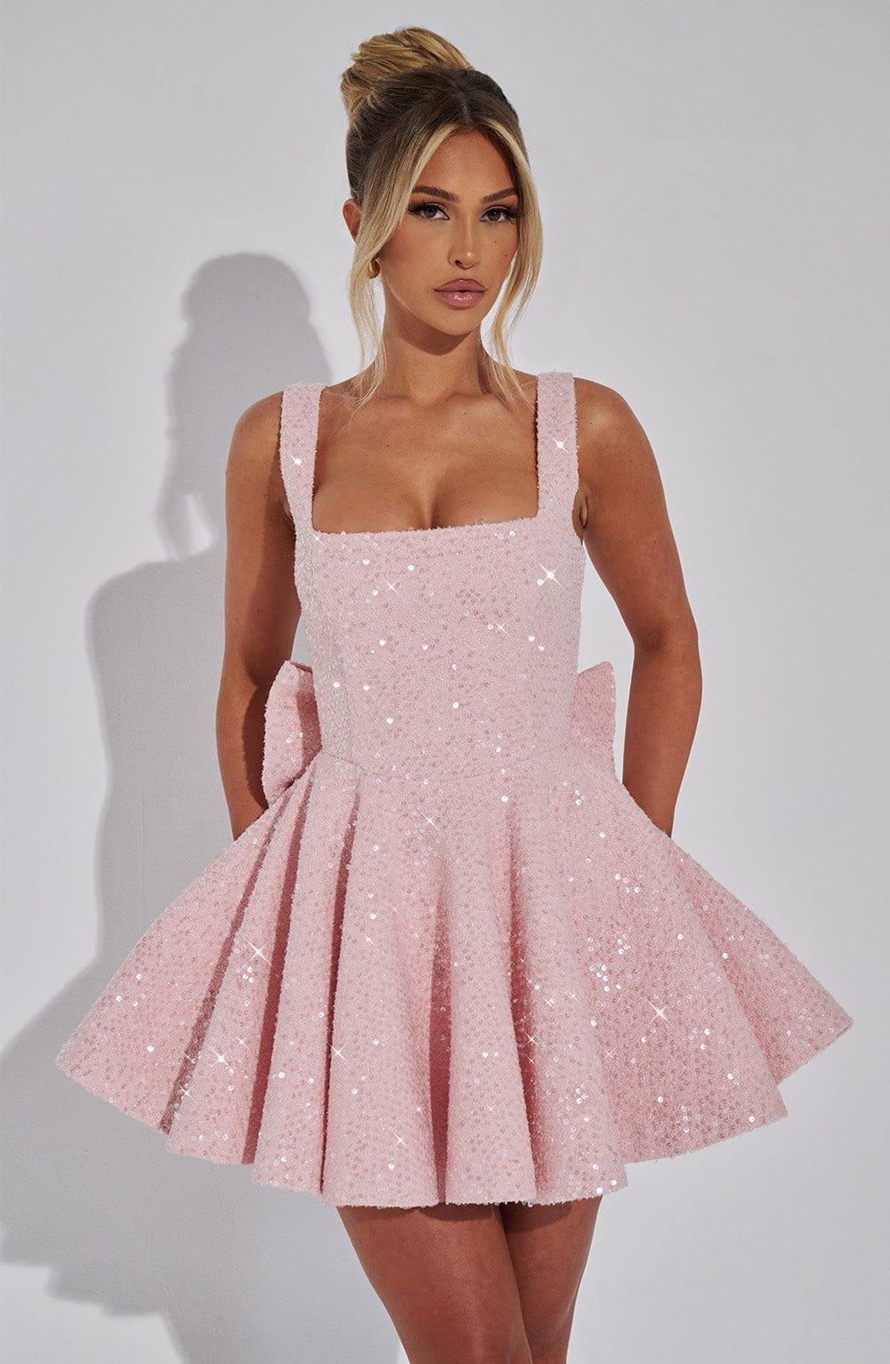 Elegant women's flared sequin dress with a dazzling bow, perfect for homecoming, cocktail & dance.