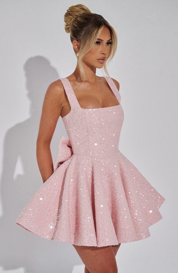 Women's white sequin bow skater dress, a festive party or special occasion outfit.