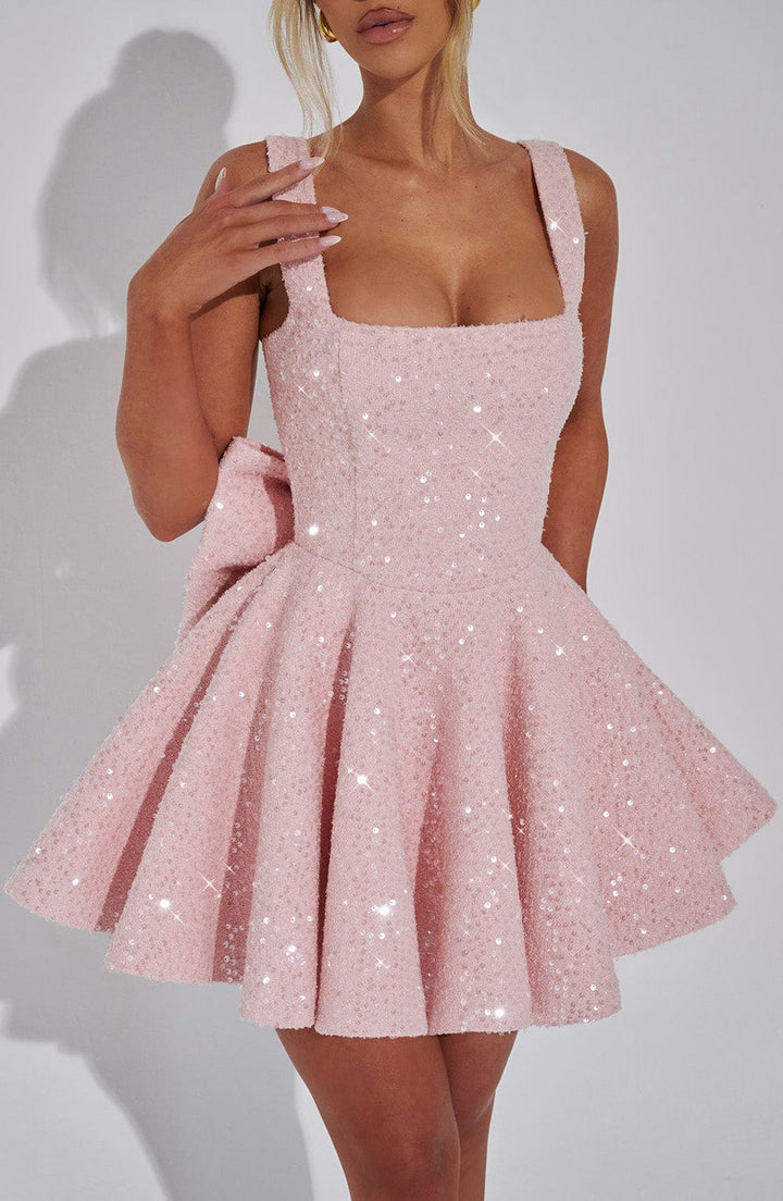 Glamorous women's sequin homecoming dress. Flared skater style with a decorative bow.